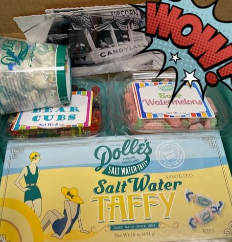 mailer showing Dolle's® postcards, Bear Cubs and Sour Watermelon gummies, and salt water taffy box