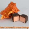 unwrapped and split in half Chocolate Covered Sweet Orange Taffy