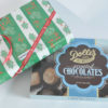 2 boxes of Dolle's® assorted Chocolates one with Christmas wrapping