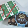2 boxes of Dolle's® assorted Chocolates one with Christmas wrapping