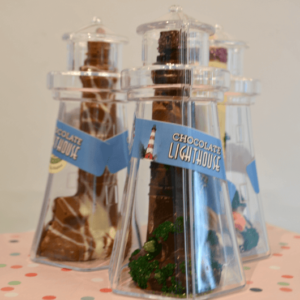 solid chocolate lighthouses inside clear lighthouse containers