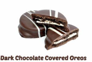 2 Dark Chocolate Covered Oreos with one cut in half