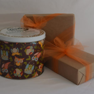 owl design decorated caramel popcorn tin and gift wrapped boxes