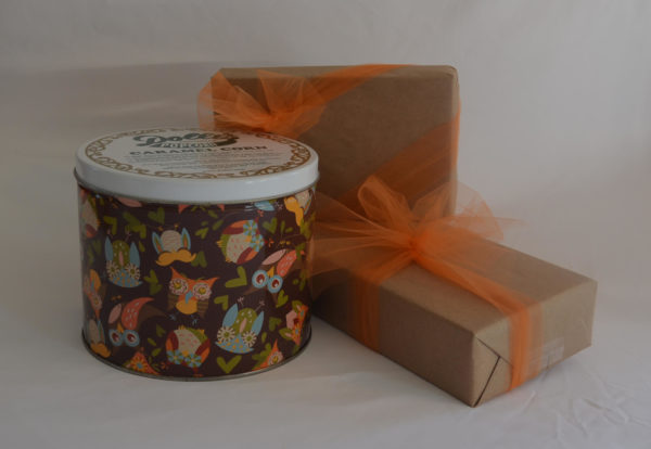 owl design decorated caramel popcorn tin and gift wrapped boxes