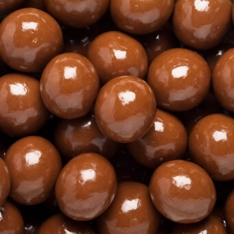 close up on pile of Chocolate Covered Malt Balls