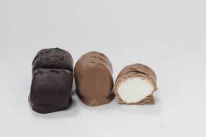 3 Chocolate Covered Marshmallows with one cut open