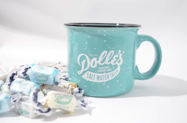 green ceramic mug with the Dolle's® logo and loose taffy