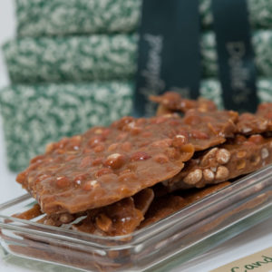 Dolle's® Deluxe Brittles stacked in clear plastic tray