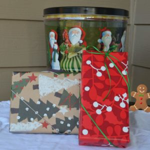 holiday decorated tin and fesitve wrapped boxes