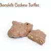 2 Milk Chocolate Cashew Turtles with one cut in half