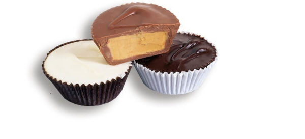 3 large peanut buter cups with milk, dark, and white chocolate shells