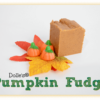 piece of Pumpkin Fudge on fall leaves with Mellowcreme Pumpkins