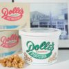 Dolle's® 1/2 gallon tub and popcorn next to boxes of salt water taffy